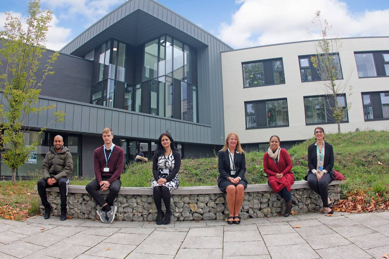 Lambeth College sitting socially distanced outside the College